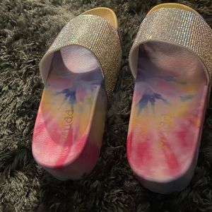 Woman’s tie-dye sandals